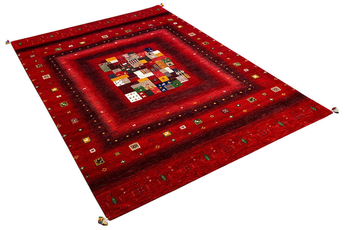 Red Gabbeh rug diagonal, with centered patchwork square pattern and border