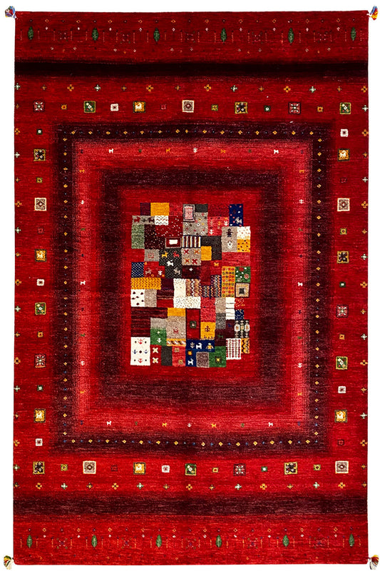 Red Gabbeh rug with a multicolored patchwork medallion and ornate border