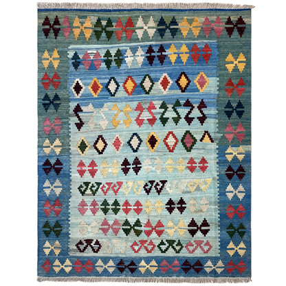 Blue kilim rug with a striped pattern of diamonds and crosses, fringed edges