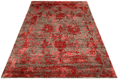 Rectangular designer rug with an ornamental-looking pattern in red and gray