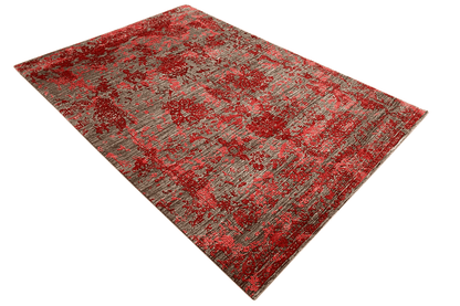 Rectangular designer rug with accent lines, red and gray in the overall patterned design