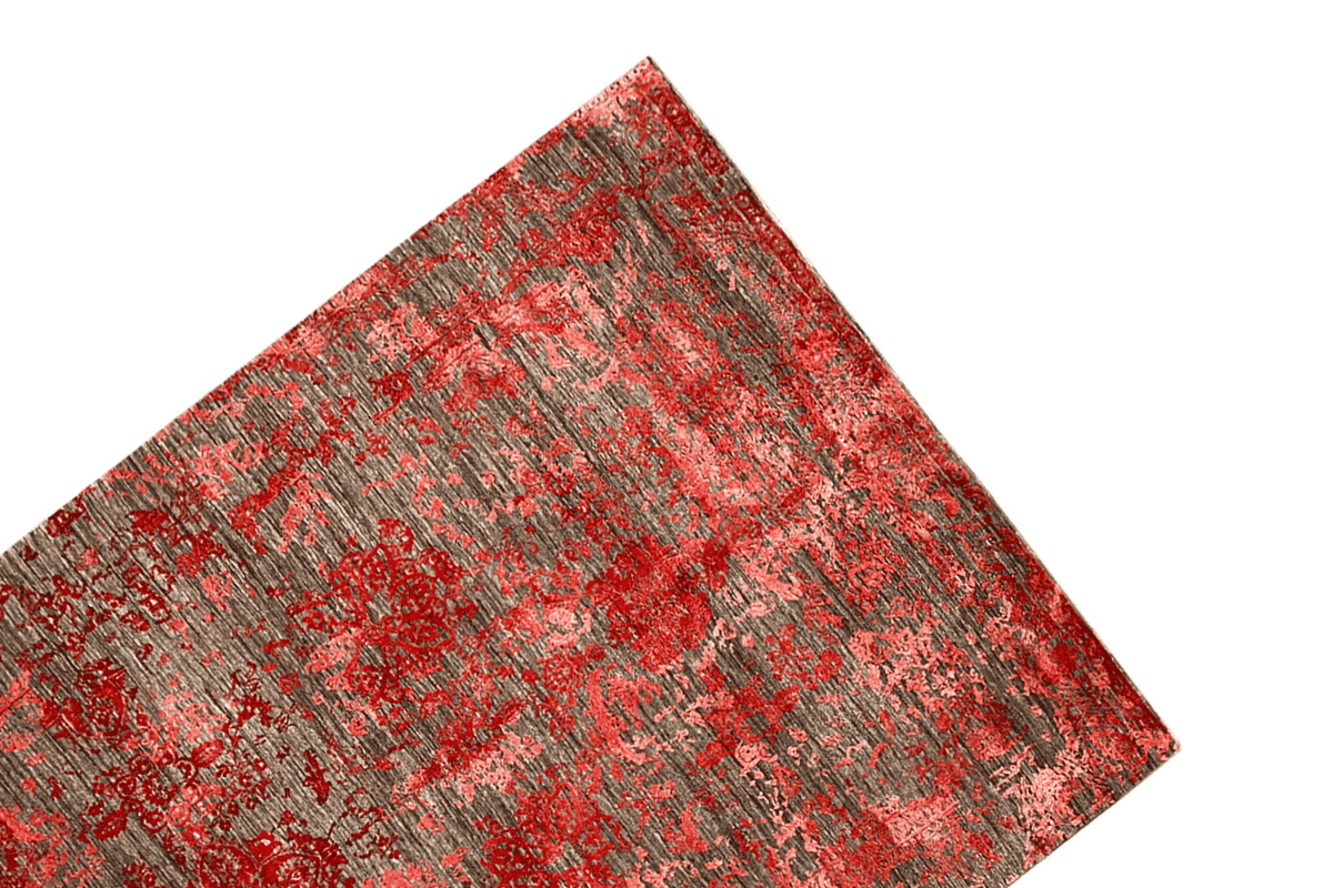 Carpet area positioned at an angle: red-gray pattern with a clearly visible edge