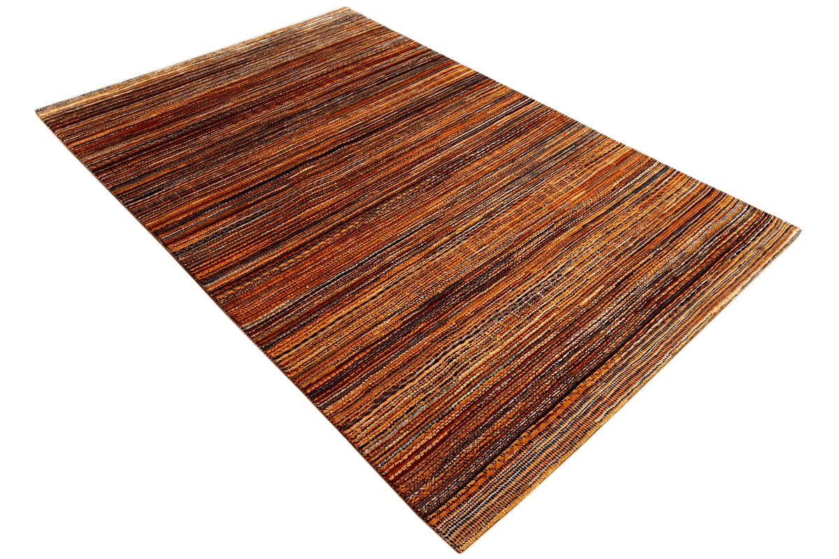Carpet, lying at an angle, with a ribbed striped pattern in brown and orange