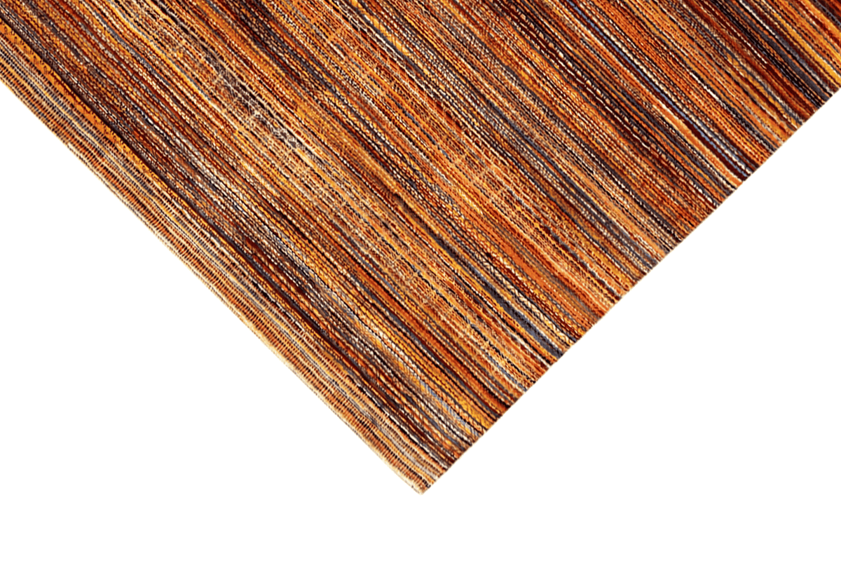 Carpet edge with a brown-orange thread grid and fine stripes