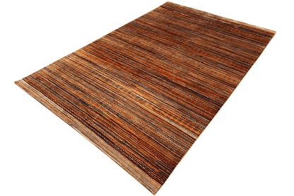 Hand-knotted rug at an angle, multicolored vertical stripes in brown and beige
