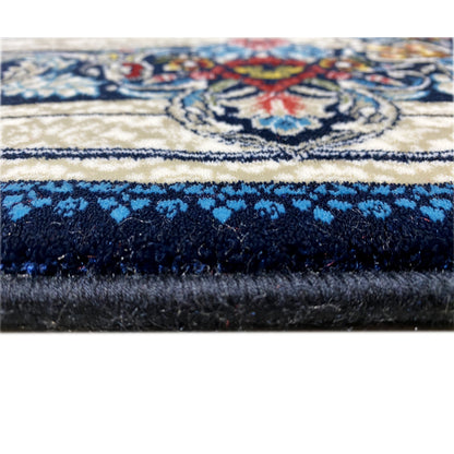 Blue and white rug with medallion and floral border design
