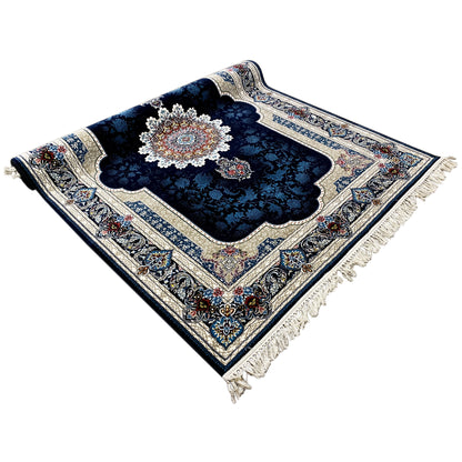 Navy blue rug with an ornamental pattern, floral border, and fringes