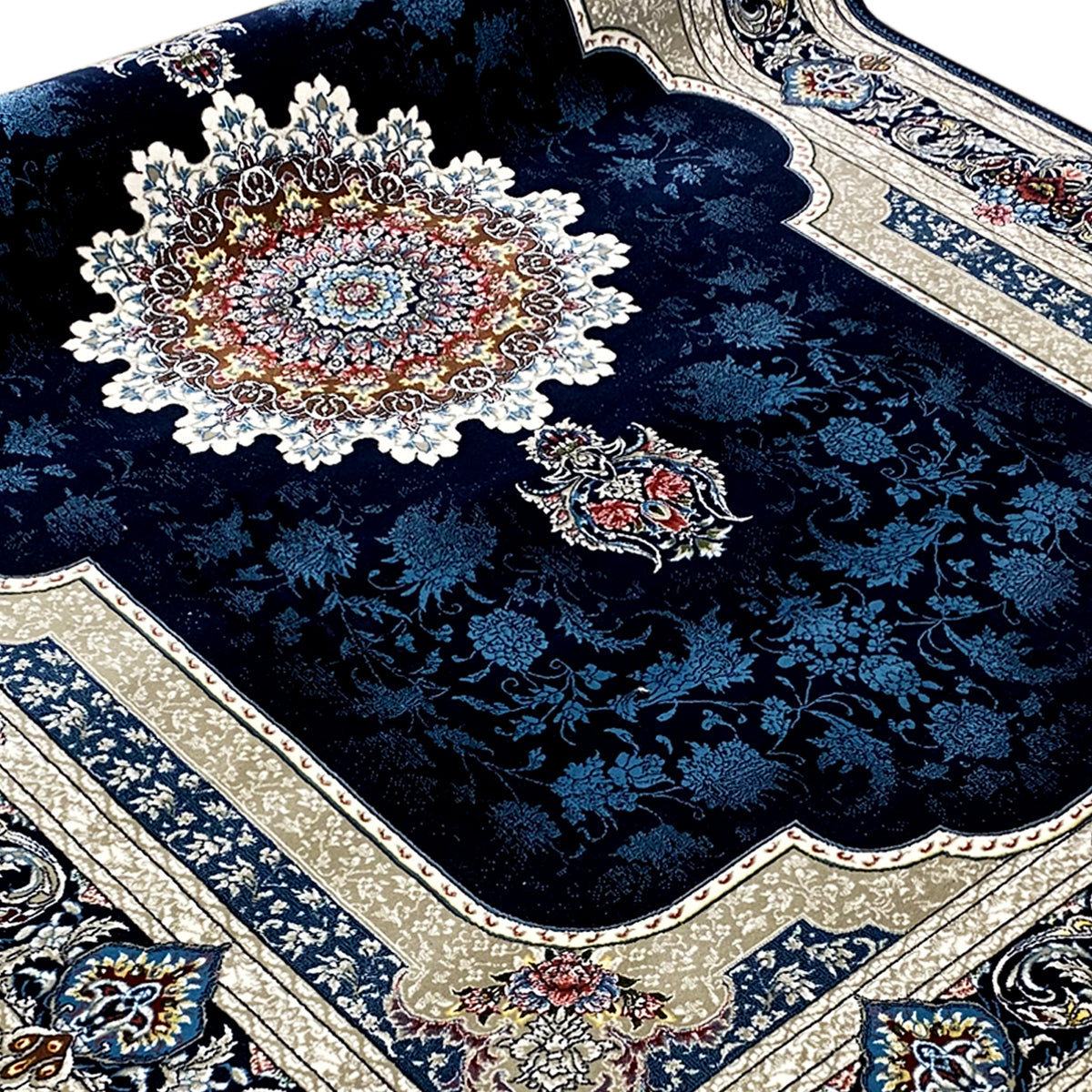 Detail view: navy blue rug with medallion, Baroque ornaments, and border