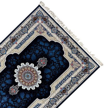 Corner view: navy blue rug with medallion, border ornaments, and tassels