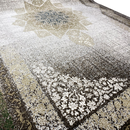 Rug detail with star and diamond pattern, speckled surface in white, gray, and green