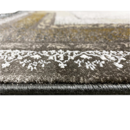 Carpet edge in detail with short fringes and dense pile, patterned in light and dark brown/gold