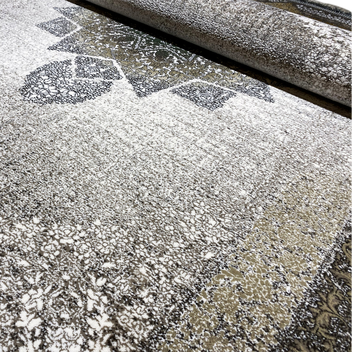 Carpet surface in detail: dense relief with ornaments, a light background, and dark speckles/gradients