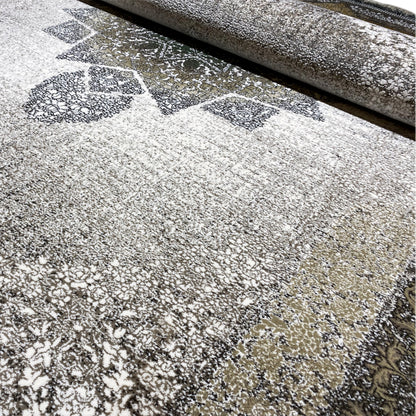 Carpet surface in detail: dense relief with ornaments, a light background, and dark speckles/gradients