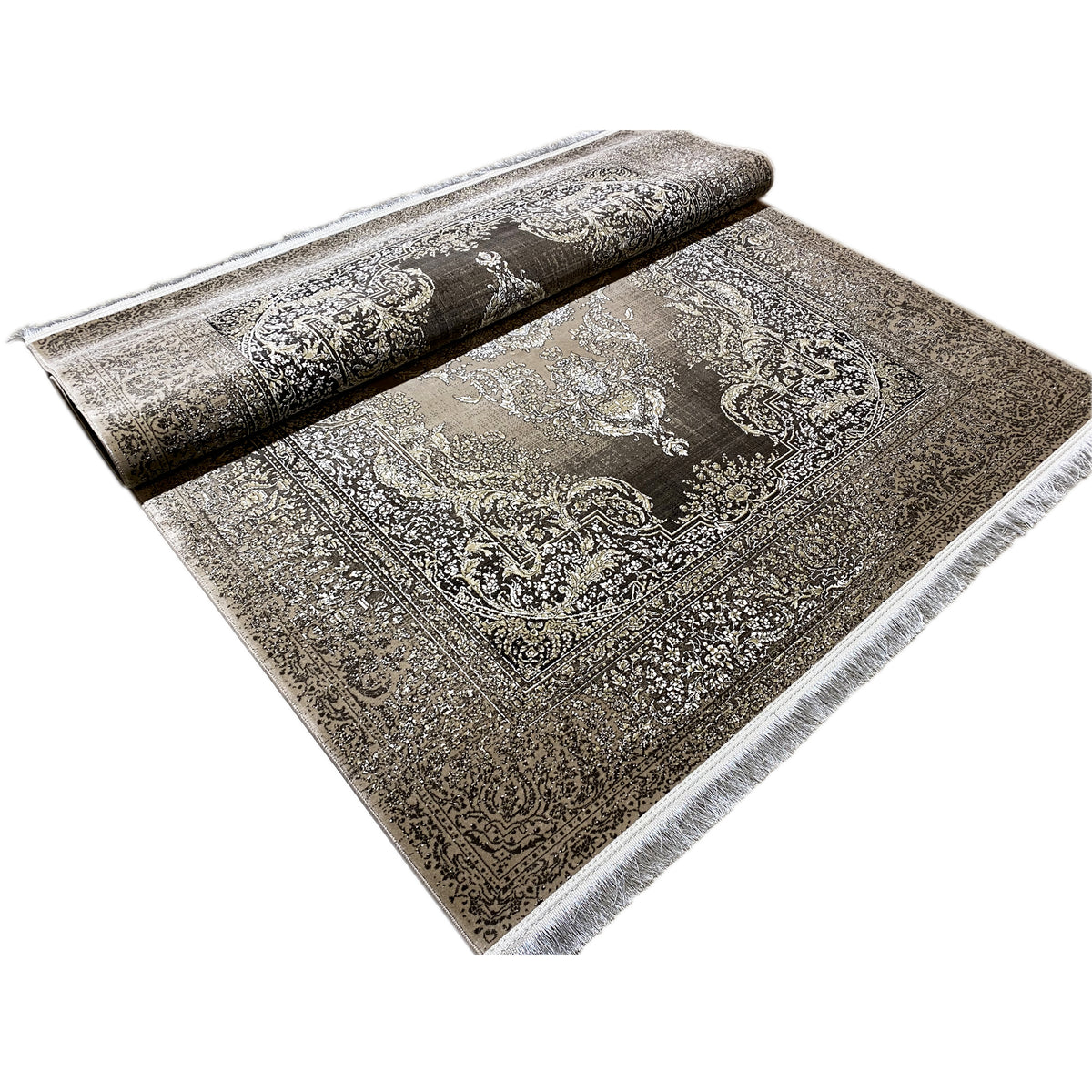 Rug with a medallion pattern in antique silver and a dark background, with fringes