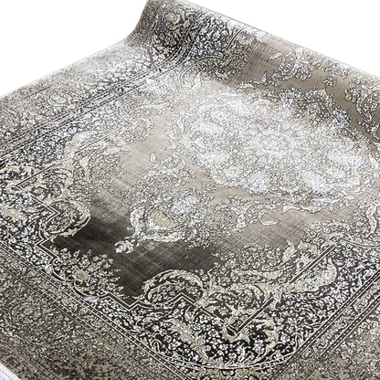 Rug with large medallions and delicate ornaments, silver-gray on a dark background