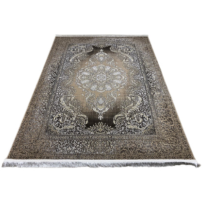 Flat-laid rug: central medallion, richly decorated border, fringed edge
