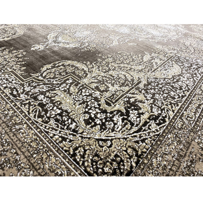 Carpet detail border: silver embellishments, dark gray background, textured surface