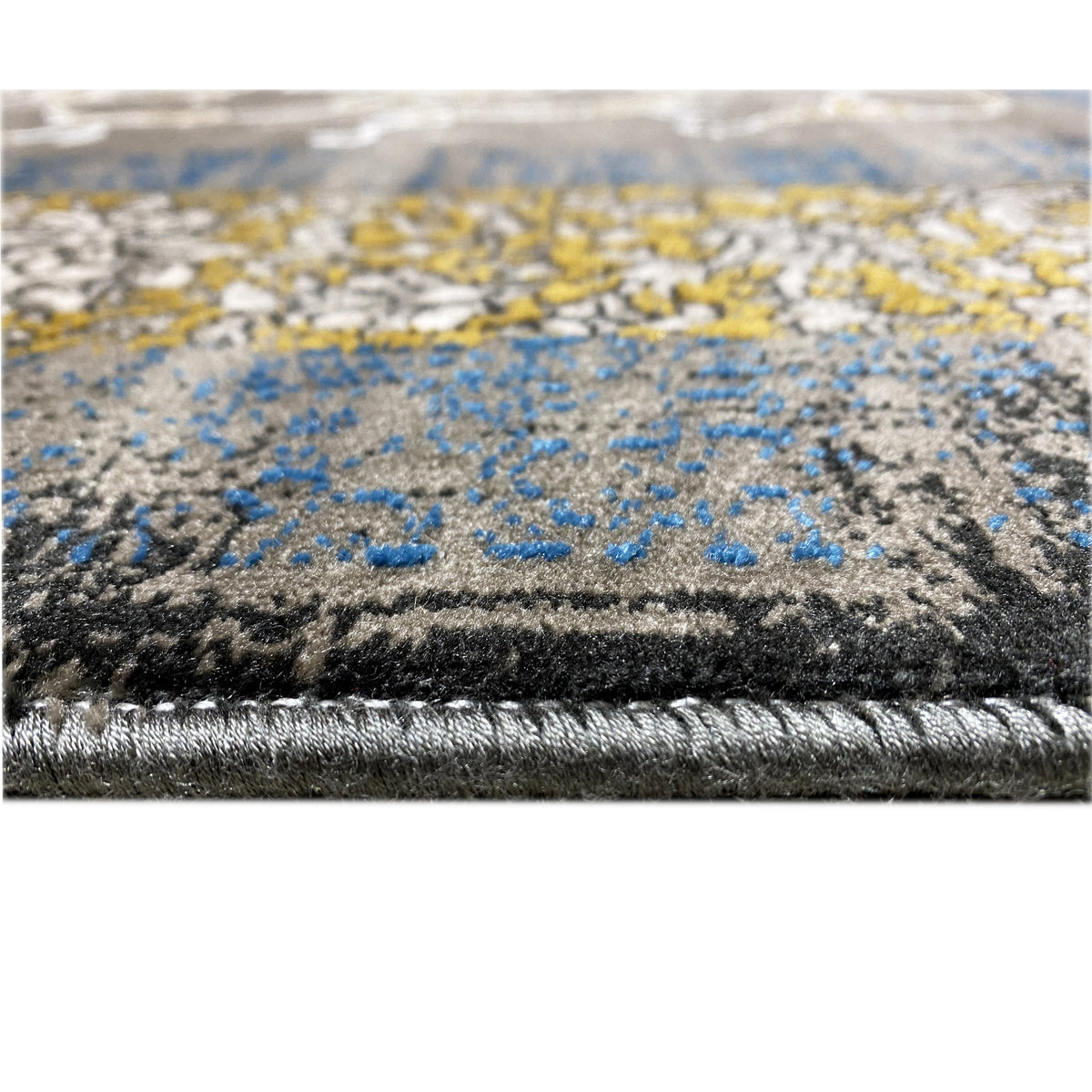 Dark grape carpet: dark pile with a blue-gray pattern, stitched edge