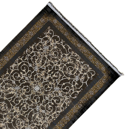 Dark rug with a gold-colored pattern and fringes along the edge