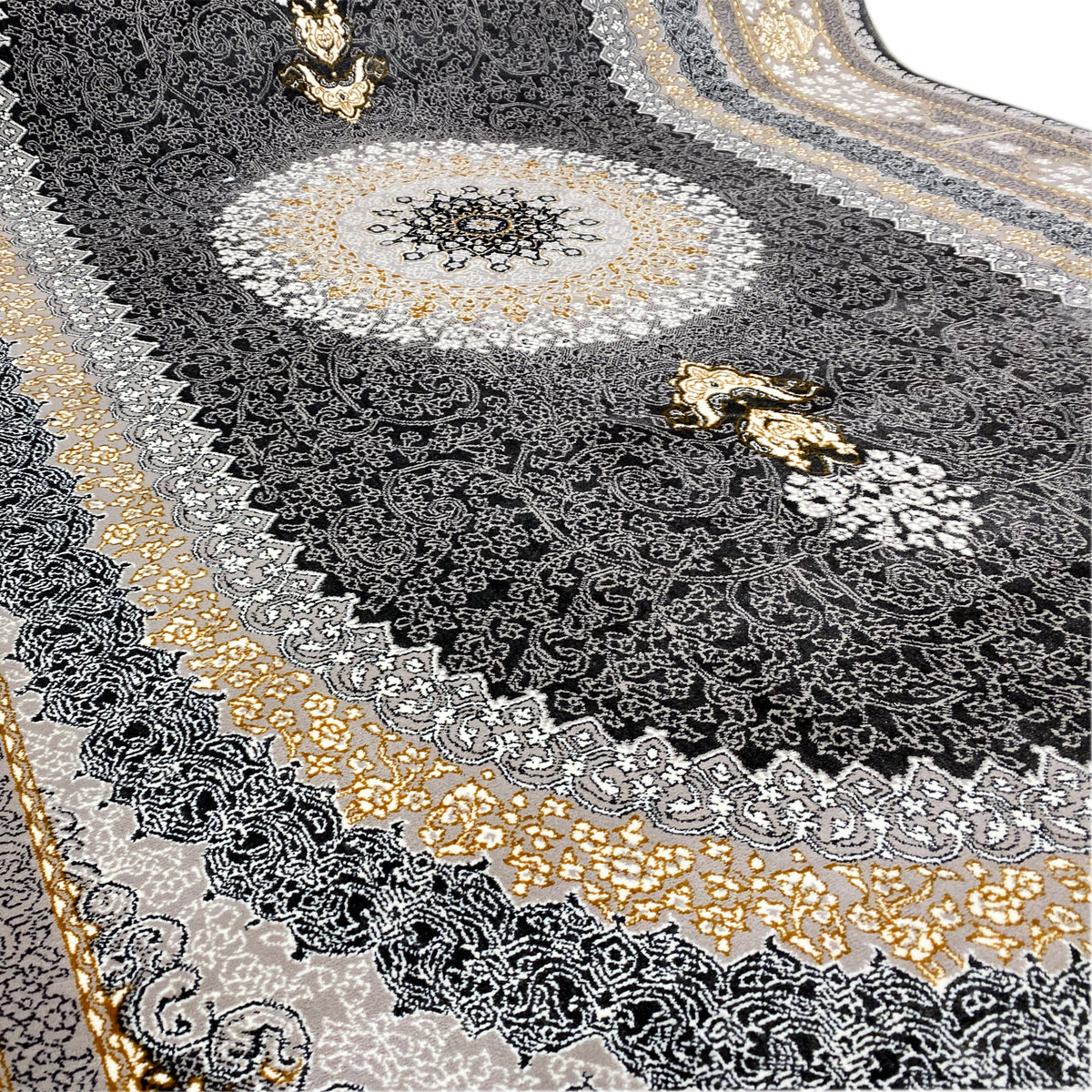 Carpet detail with a dark ornamental pattern, silver-gray embellishments, and gold-colored motifs
