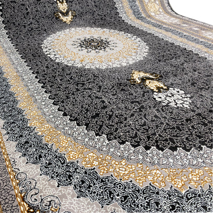Carpet detail with a dark ornamental pattern, silver-gray embellishments, and gold-colored motifs