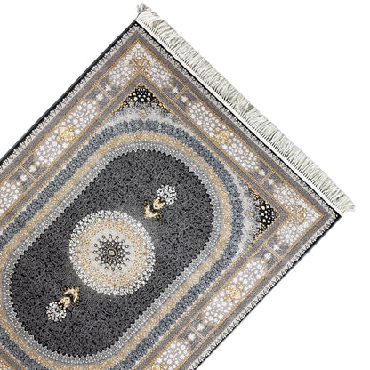 Ornamental rug photographed at an angle: central medallion, dark border, and fringe