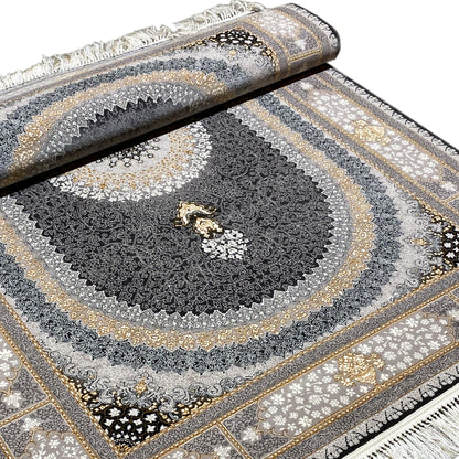 “Lara” rug close-up: dark pile ornament with a circular pattern and fringes