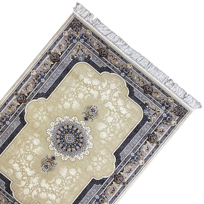 Edge view: beige rug with an ornamental border in blue, dark blue, and fringes
