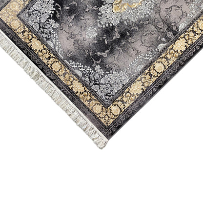 Close-up of a carpet corner: gold decorative stripe, black border, and fringes along the edge