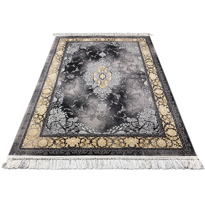 Rug with gray floral design, shimmering gold center appliqué, and fringe