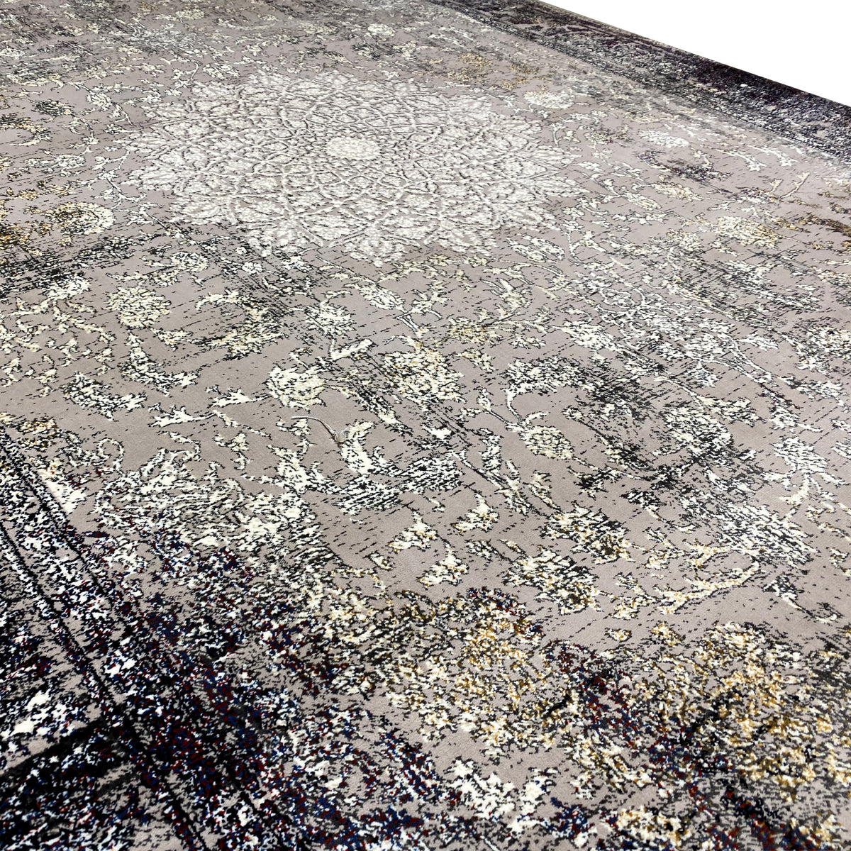 Rectangular vintage rug with a detailed ornamental pattern in gray and dark accents
