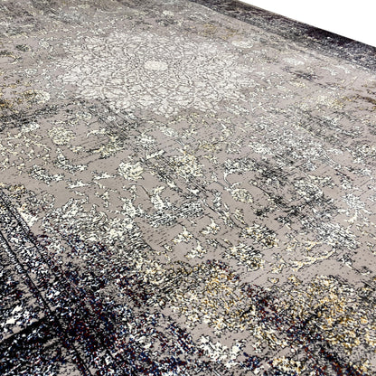 Rectangular vintage rug with a detailed ornamental pattern in gray and dark accents