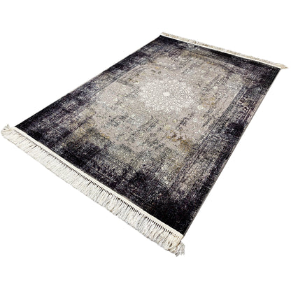 Rectangular vintage rug in gray/charcoal with a beige fringed border, laid flat