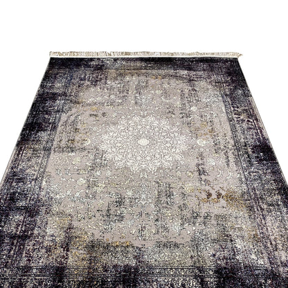 Vintage rug with a large ornamental pattern, light beige center, dark gradients, fringe