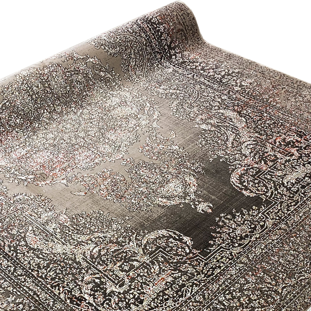 Oriental rug with a large central medallion and contrasting decorative borders, rolled