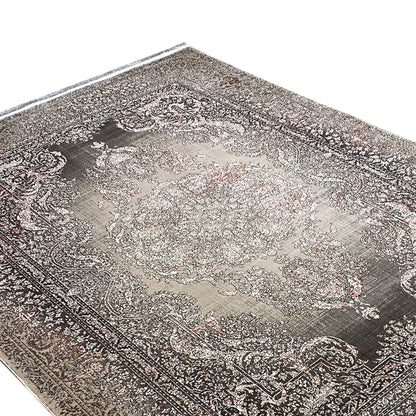 Rug surface with a silver-gray center and dark paisley ornaments, fine texture