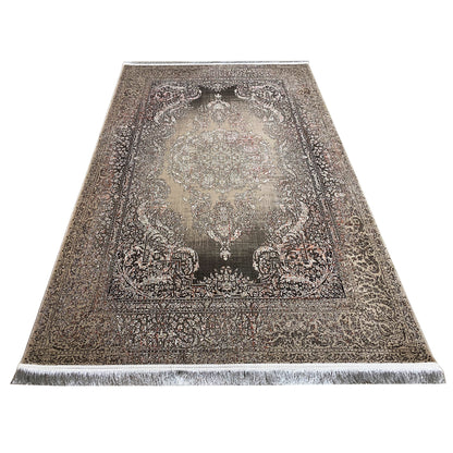 Rug in conical view: silver-gray with a dark medallion and surrounding ornamental border