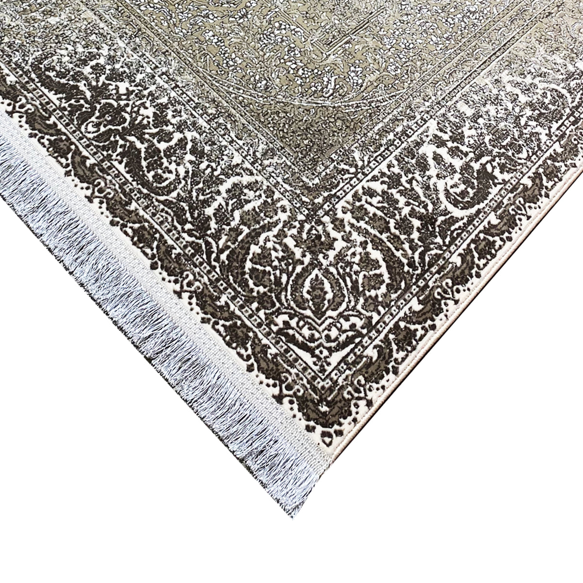Carpet corner detail: dark ornamental element with a silvery border and cream-colored background