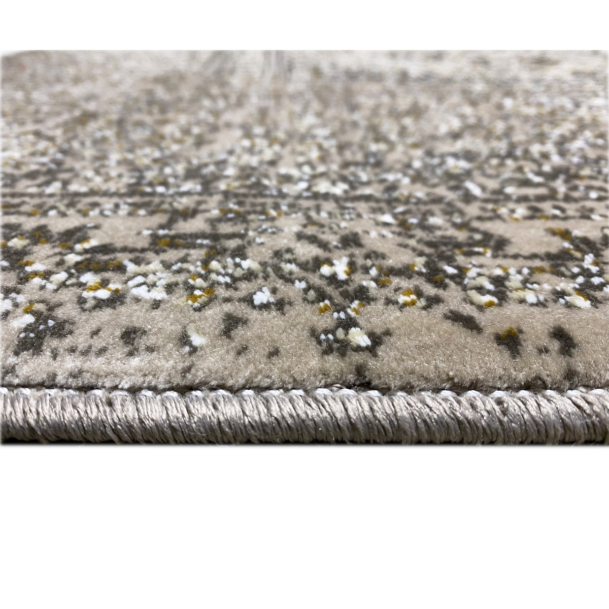 Rug edge with fringe and dense pile, brown-gray with beige pattern elements