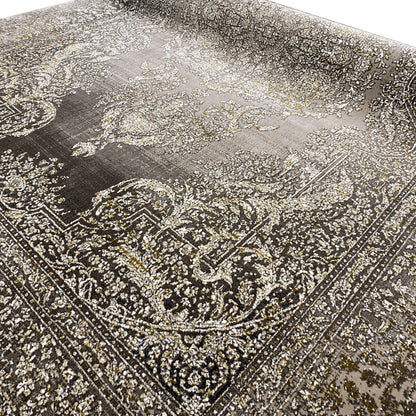 Carpet front side with paisley and vine ornaments in beige on dark gray