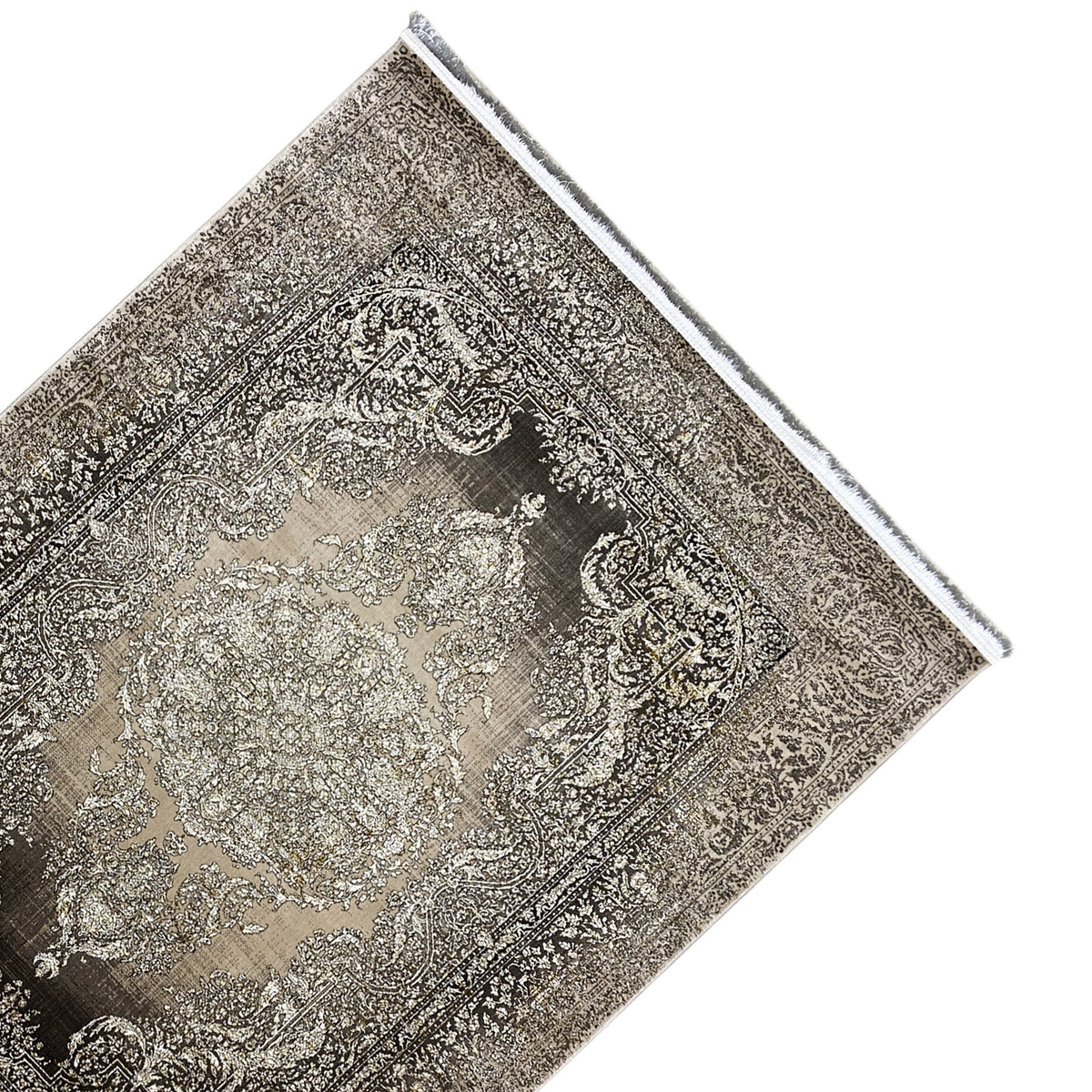 Carpet detail with an ornamental pattern and fringed border, brown-gray/beige, diagonal