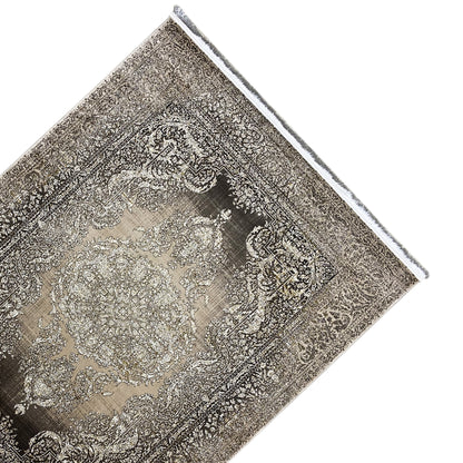 Carpet detail with an ornamental pattern and fringed border, brown-gray/beige, diagonal