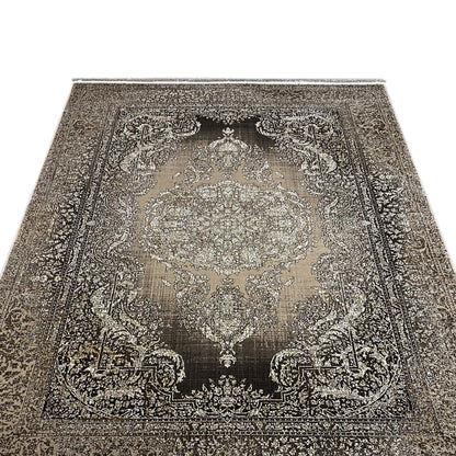 Carpet viewed from the front with a large ornamental medallion, dark background, fringed edge