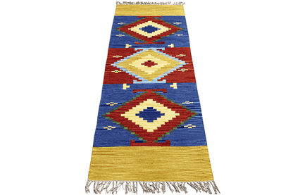 Kilim dhurrie rug with a diamond pattern, blue and red, yellow border, with fringes