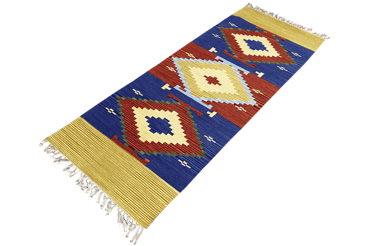 Wool kilim runner with a diamond design in blue, red, and cream, yellow border, fringes at the corners