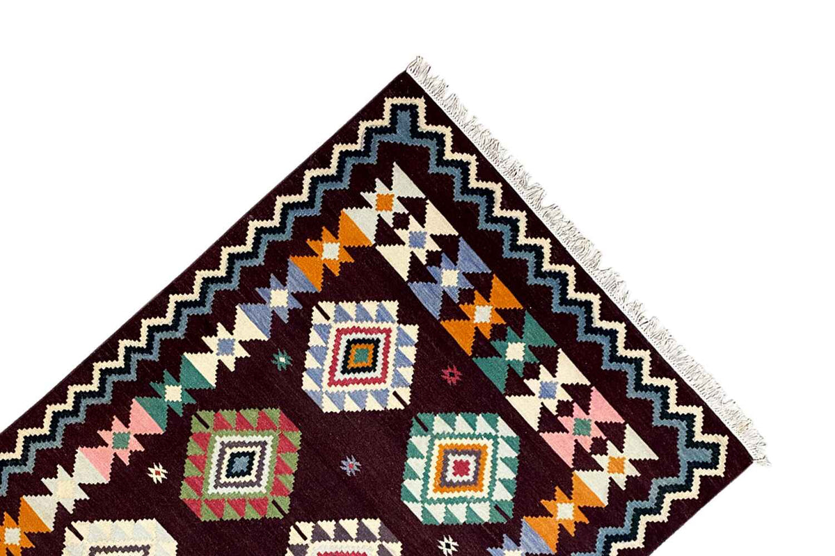 Kilim rug corner with geometric quadrilaterals and a zigzag border, multicolored, fringes