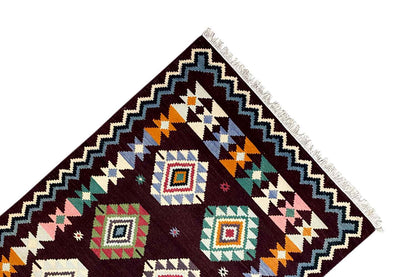 Kilim rug corner with geometric quadrilaterals and a zigzag border, multicolored, fringes