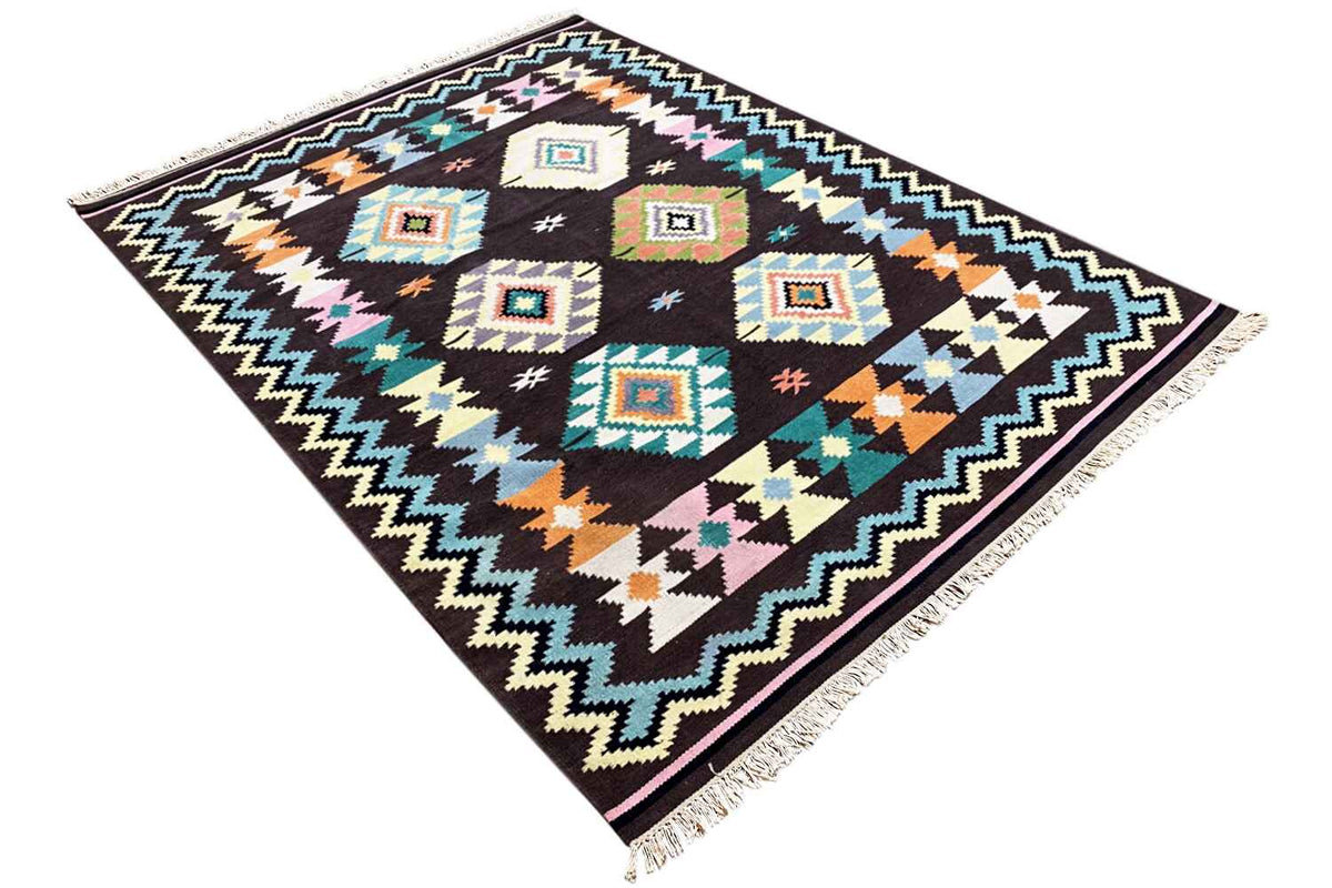 Kelim rug in a diagonal pattern: geometric squares with color accents on a dark background