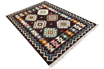 Wool kilim rug, diagonal view, multicolored squares in a zigzag frame