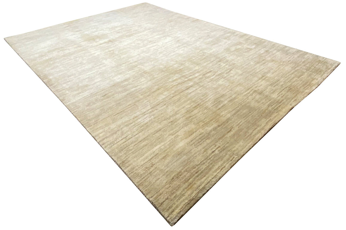 Light beige Gabbeh rug with a visible woven texture and uniform linear pattern